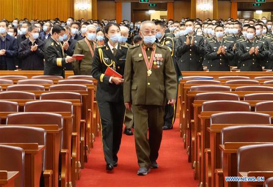 A Chinese People's Volunteers (CPV) veteran enters the venue of the meeting marking the 70th anniversary of the CPV entering the Democratic People's Republic of Korea to fight in the War to Resist U.S. Aggression and Aid Korea at the Great Hall of the People in Beijing, capital of China, Oct. 23, 2020. (Xinhua/Lai Xiangdong)