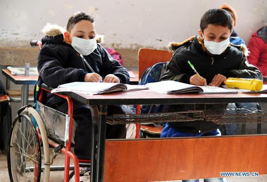  Children study at school in Damascus, Syria on Nov. 18, 2020. The globe will mark this year's World Children's Day on Friday. (Photo by Ammar Safarjalani/Xinhua)