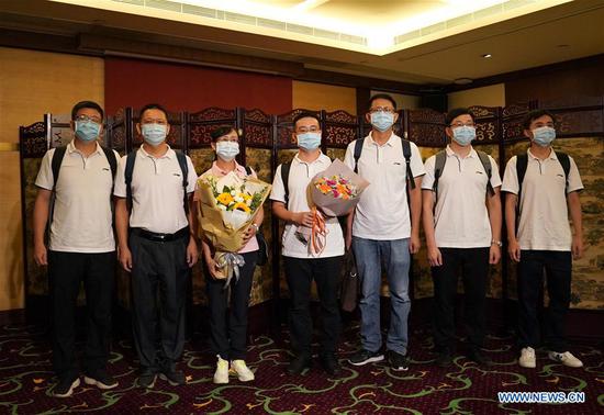 Virus testing professionals from the Chinese mainland pose for a group photo after their arrival in Hong Kong, south China, Aug. 2, 2020. Seven virus testing professionals from the Chinese mainland arrived in Hong Kong on Sunday afternoon as the first batch of mainland supportive teams to help contain a worsening spread of COVID-19 in Hong Kong. (Xinhua/Li Gang)