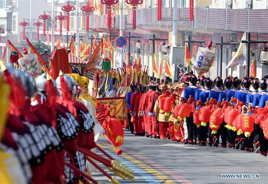 A statue of the Chinese sea goddess Mazu is in a parade around the Meizhou Island in Putian City, southeast China's Fujian Province, Oct. 25, 2020. In 2009, the Mazu belief and customs were inscribed on the UNESCO Representative List of the Intangible Cultural Heritage of Humanity. (Xinhua/Wei Peiquan)