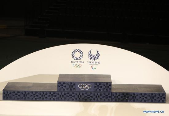 The podium is seen during an unveiling event of the items that will be used for the victory ceremonies of the Tokyo 2020 Olympic and Paralympic Games at Ariake Arena in Tokyo, Japan on June 3, 2021. (Xinhua/Wang Zijiang)