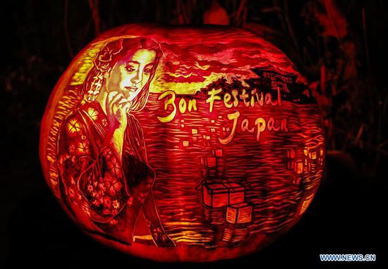 A carved pumpkin is seen at the Chicago Botanic Garden's Night of 1000 Jack-O'-Lanterns in Glencoe, Illinois, the United States, on Oct. 24, 2020. More than 1,000 hand-carved pumpkins are on display here pending Halloween. (Photo by Joel Lerner/Xinhua)
