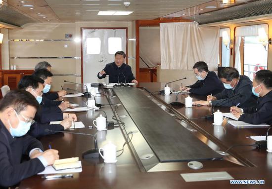 Chinese President Xi Jinping, also general secretary of the Communist Party of China Central Committee and chairman of the Central Military Commission, inspects the Danjiangkou Reservoir and listens to introductions to the construction, management and operation of the middle route of the South-to-North Water Diversion Project, and the ecological conservation of the water source region in Xichuan County, Nanyang, central China's Henan Province, May 13, 2021. (Xinhua/Wang Ye)