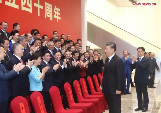 Chinese President Xi Jinping, also general secretary of the Communist Party of China Central Committee and chairman of the Central Military Commission, meets with participants of a grand gathering held to celebrate the 40th anniversary of the establishment of the Shenzhen Special Economic Zone in Shenzhen, south China's Guangdong Province, Oct. 14, 2020. Xi attended the gathering and delivered an important speech on Wednesday. (Xinhua/Ju Peng)