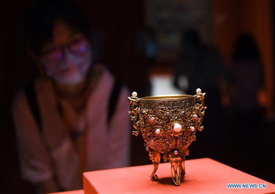 A visitor views an exhibit at the Palace Museum in Beijing, capital of China, Sept. 10, 2020. An exhibition, entitled 