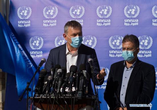 Commissioner-General of the UNRWA Philippe Lazzarini (L) speaks during a press conference in Gaza City, on Jan. 14, 2021. A United Nations official announced on Thursday that the United Nations Relief and Works Agency for Palestine Refugees in the Near East (UNRWA) holds contacts with U.S. President-elect Joe Biden's office on resuming the U.S. financial support to the Palestinian refugees. (Photo by Rizek Abdeljawad/Xinhua)