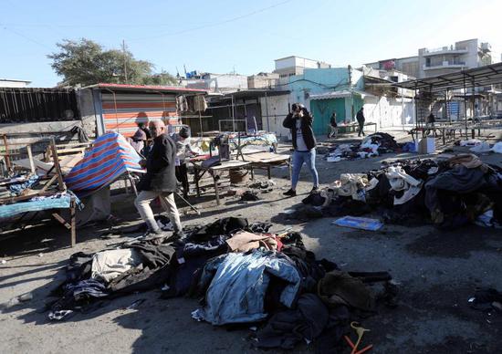 Photo taken on Jan. 21, 2021 shows the market damaged by suicide bombings in Iraq's capital Baghdad. At least 32 people were killed and 110 others wounded on Thursday in the twin suicide bombings in Iraq's capital Baghdad, Iraqi Health Minister Hassan al-Tamimi said. Baghdad's hospitals received 32 bodies, while 110 wounded people were admitted for treatment, al-Tamimi said in a statement. Earlier in the morning, a suicide bomber blew up his explosive belt in a crowded outdoor clothing market in Bab al-Sharji area, before a second one detonated his a few minutes later in the same market, an Interior Ministry source told Xinhua on condition of anonymity. (Xinhua)