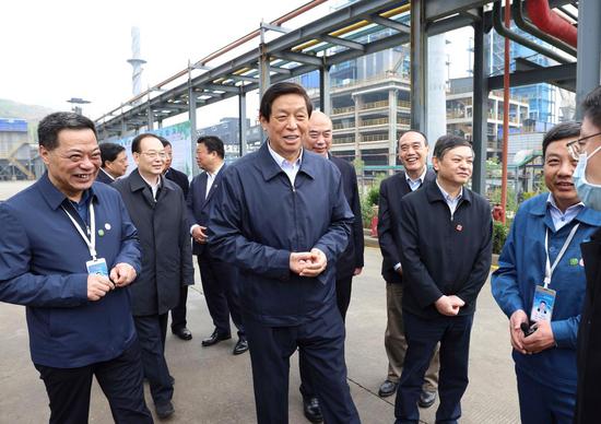 Li Zhanshu, a member of the Standing Committee of the Political Bureau of the Communist Party of China Central Committee and chairman of the National People's Congress Standing Committee, learns about the safe disposal and recycling of industrial waste slag at a zinc industry company in Hanzhong, northwest China's Shaanxi Province, April 11, 2021. Li inspected the enforcement of the Law on Prevention and Control of Environmental Pollution by Solid Waste in Shaanxi Province from April 9 to 13. (Xinhua/Huang Jingwen)