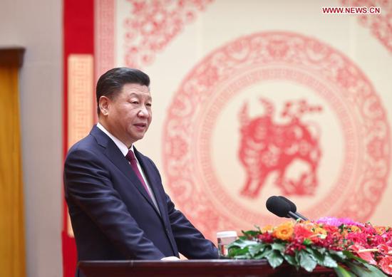 Chinese President Xi Jinping, also general secretary of the Communist Party of China (CPC) Central Committee and chairman of the Central Military Commission, addresses a Chinese Lunar New Year reception at the Great Hall of the People in Beijing, capital of China, Feb. 10, 2021. The CPC Central Committee and the State Council held the reception on Wednesday in Beijing. (Xinhua/Ju Peng)