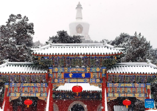 Photo taken with a mobile phone shows a snow view of Beihai Park in Beijing, capital of China, Feb. 13, 2022. A snowfall hit Beijing on Sunday. (Xinhua/Pan Xu)