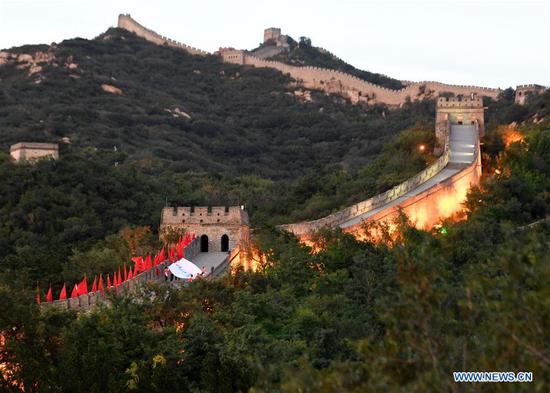 The flag of Beijing 2022 Winter Olympic Games is shown on the Great Wall during cultural activities to welcome the Beijing 2022 Olympic Winter Games' 500-day countdown in Badaling, Yanqing District of Beijing, capital of China, Sept. 20, 2020. (Xinhua/Zhang Chenlin)