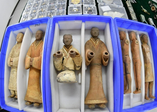 A picture taken with a fish-eye lens on Dec. 16, 2021 shows ancient colored pottery figurines unearthed from the large-scale mausoleum and the mausoleum of Empress Dowager Bo, mother of Emperor Wendi of the Western Han Dynasty (202 BC-AD 25), in northwest China's Shaanxi Province. (Xinhua/Zhang Bowen)