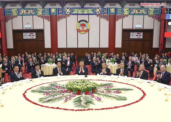 Leaders of the Communist Party of China and the state Xi Jinping, Li Keqiang, Li Zhanshu, Wang Yang, Wang Huning, Zhao Leji, Han Zheng and Wang Qishan attend the New Year gathering held by the National Committee of the Chinese People's Political Consultative Conference (CPPCC) in Beijing, capital of China, Dec. 31, 2020. The leaders also watched a performance at the gathering. (Xinhua/Ju Peng)