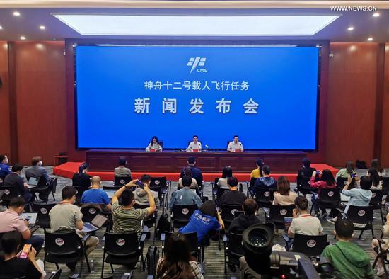 Photo taken with mobile phone on June 16, 2021 shows a press conference on the Shenzhou-12 manned spaceflight mission at the Jiuquan Satellite Launch Center in northwest China. (Xinhua/Ju Zhenhua)