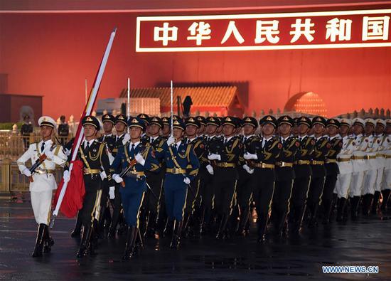 A flag-raising ceremony to celebrate the 71st anniversary of the founding of the People's Republic of China is held at the Tian'anmen Square in Beijing on Oct. 1, 2020. [Photo/Xinhua]