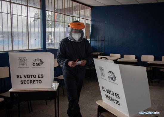 A man votes at a polling station in Saquisili, Ecuador, April 11, 2021. The National Electoral Council (CNE) of Ecuador reported on Sunday that the second round of presidential election is progressing normally. (Photo by Santiago Armas/Xinhua)