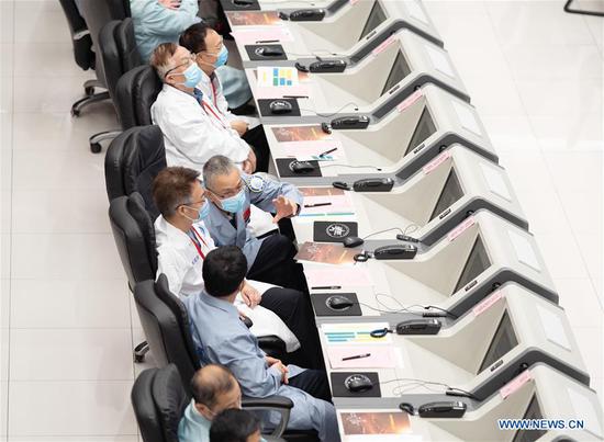 Technical personnel work at the Beijing Aerospace Control Center (BACC) in Beijing, capital of China, Aug. 2, 2020. China's Mars probe Tianwen-1 successfully carried out its first orbital correction at 7 a.m. (2300 GMT Saturday) after its 3,000N engine worked for 20 seconds, and continued to head for the Mars. (Xinhua/Cai Yang)