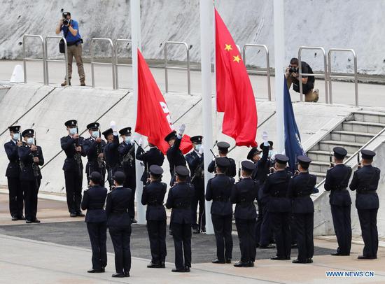 Photo taken on April 15, 2021 shows a flag-raising ceremony held at the Hong Kong Police College in south China's Hong Kong. (Xinhua/Li Gang)