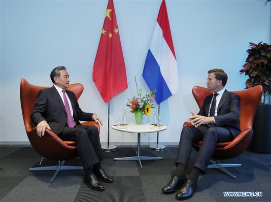 Visiting Chinese State Councilor and Foreign Minister Wang Yi meets with Dutch Prime Minister Mark Rutte in the Hague, the Netherlands, Aug. 26, 2020. (Xinhua/Zheng Huansong)