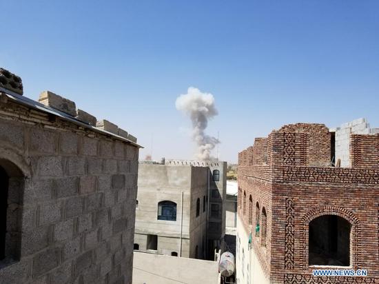 Smoke rises from a site of Saudi-led coalition airstrike in Sanaa, Yemen on March 7, 2021. The Saudi-led coalition on Sunday launched a series of airstrikes on Houthi-controlled military sites in Yemen's capital Sanaa, local residents said. (Photo by Mohammed al-Azaki/Xinhua)