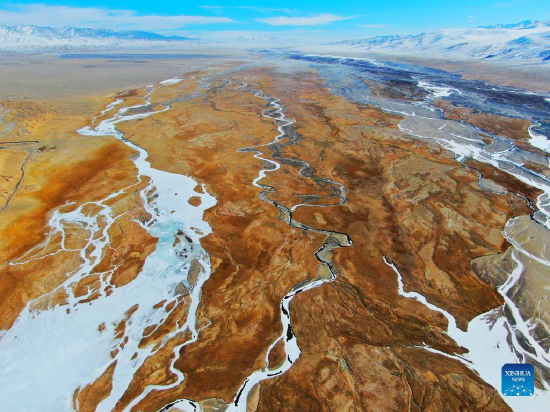 Aerial photo shows the winter scenery of the Haltent grassland in the Kazak Autonomous County of Aksay, northwest China's Gansu Province, Jan. 8, 2022. (Photo by Ma Xiaowei/Xinhua)