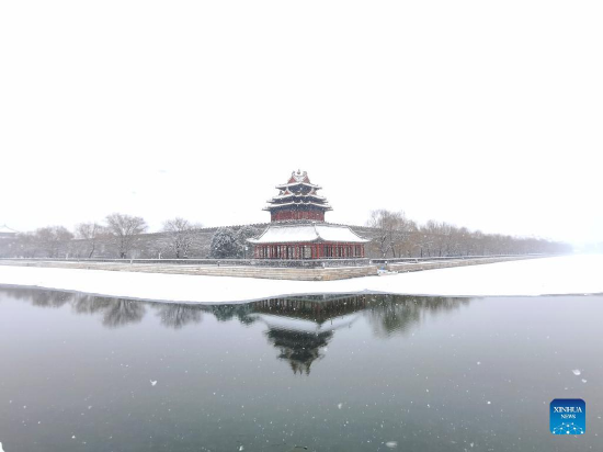 Photo taken on Feb. 13, 2022 shows the snow view of a turret of the Palace Museum, also known as the Forbidden City, in Beijing, capital of China. A snowfall hit Beijing on Sunday. (Xinhua/Ding Hongfa)