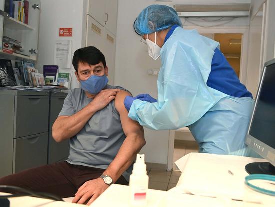 Hungarian President Janos Ader receives an injection of China's Sinopharm vaccine against COVID-19 in Budapest, Hungary, Feb. 26, 2021. (Photo by Noemi Bruzak/MTI/Handout via Xinhua)