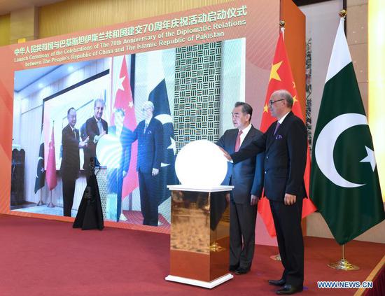 Chinese State Councilor and Foreign Minister Wang Yi attends a virtual ceremony with Pakistani Foreign Minister Shah Mahmood Qureshi to formally commence the celebrations of the 70th anniversary of diplomatic relations between the two countries in Beijing, China, March 2, 2021. (Xinhua/Rao Aimin)