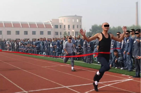 Inmates participate sports meeting inside the jail.