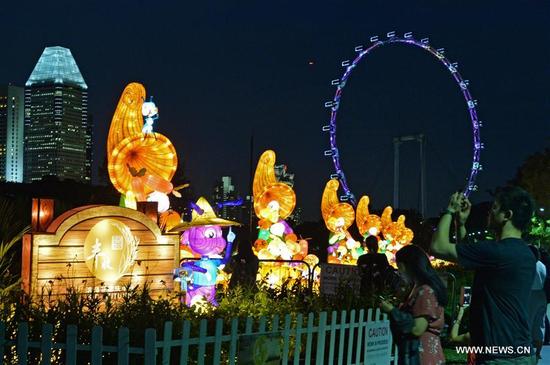 visitors view the mid autumn festival lights at singapores gardens by the bay on sep - Garden By The Bay Mid Autumn Festival 2017 visitors view the mid autumn festival lights at singapores gardens by the bay on sep - Garden By The Bay Mid Autumn Festival 2017