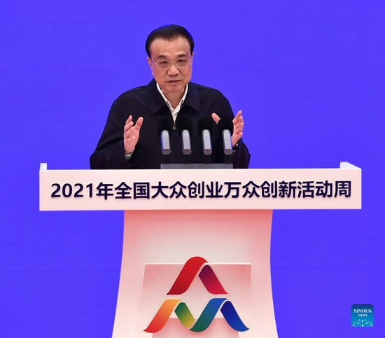 Chinese Premier Li Keqiang, also a member of the Standing Committee of the Political Bureau of the Communist Party of China Central Committee, addresses the opening ceremony of the 2021 National Mass Innovation and Entrepreneurship Week in Beijing, capital of China, Oct. 19, 2021. (Xinhua/Rao Aimin)