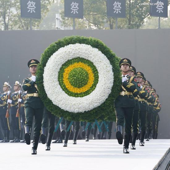 Photo taken on Dec. 13, 2020 shows the national memorial ceremony for the Nanjing Massacre victims at the Memorial Hall of the Victims of the Nanjing Massacre by Japanese Invaders in Nanjing, capital of east China's Jiangsu Province. (Xinhua/Li Xiang)