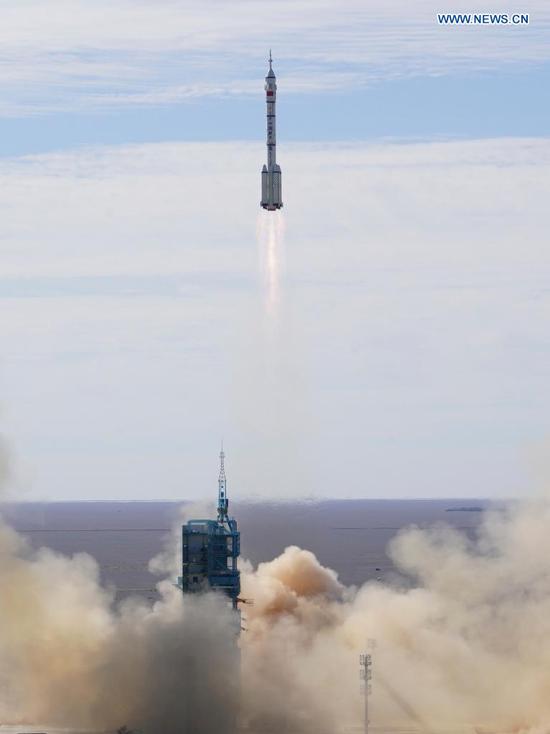 The crewed spacecraft Shenzhou-12, atop a Long March-2F carrier rocket, is launched from the Jiuquan Satellite Launch Center in northwest China's Gobi Desert, June 17, 2021. (Xinhua/Li Gang)