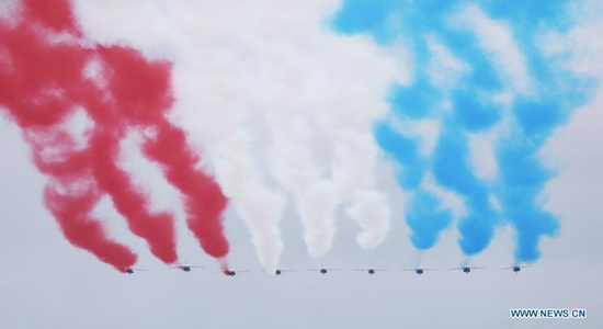 French Air Force Patrouille de France is seen during the annual Bastille Day military parade in Paris, France, July 14, 2021. France on Wednesday held its annual Bastille Day celebrations with a traditional military parade down the famous avenue of the Champs Elysees in Paris amid restrictions on public gathering due to COVID-19. (Xinhua/Gao Jing)