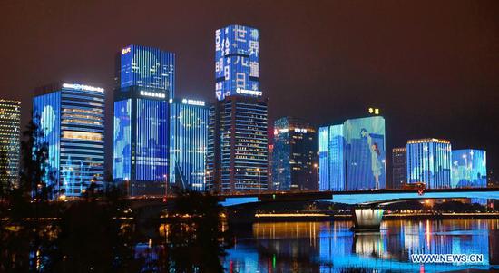 Buildings light up blue on the occasion of World Children's Day in the Straits Financial and Business Zone of Fuzhou, southeast China's Fujian Province, Nov. 20, 2020. Buildings and iconic monuments in some Chinese cities went blue on Friday to celebrate World Children's Day. World Children's Day is celebrated on November 20 each year to promote international togetherness, awareness among children worldwide, and improving children's welfare. (Xinhua/Wei Peiquan)