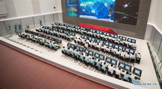 Technical personnel work at the Beijing Aerospace Control Center (BACC) in Beijing, capital of China, Aug. 2, 2020. China's Mars probe Tianwen-1 successfully carried out its first orbital correction at 7 a.m. (2300 GMT Saturday) after its 3,000N engine worked for 20 seconds, and continued to head for the Mars. (Xinhua/Cai Yang)