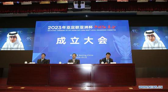 Shaikh Salman bin Ebrahim Al Khalifa (on the screens), president of the Asian Football Confederation (AFC), gives a speech during the inaugural ceremony of AFC Asian Cup China 2023 local organising committee in Beijing, capital of China, Oct. 22, 2020. (Xinhua/Ding Xu)