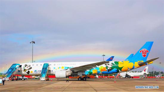 Photo taken on Sept. 19, 2020 shows a flight featuring the mascot of China International Import Expo (CIIE) at the Guangzhou Baiyun International Airport in Guangzhou, south China's Guangdong Province. The CIIE-themed airplane of China Southern Airlines made its debut here and made its maiden flight from Guangzhou to Shanghai on Saturday. (Xinhua) 