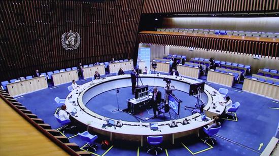 Photo taken in Brussels, Belgium on May 24, 2021 shows the live stream of the 74th World Health Assembly held at the World Health Organization (WHO) headquarters in Geneva, Switzerland. (Xinhua/Zheng Huansong)