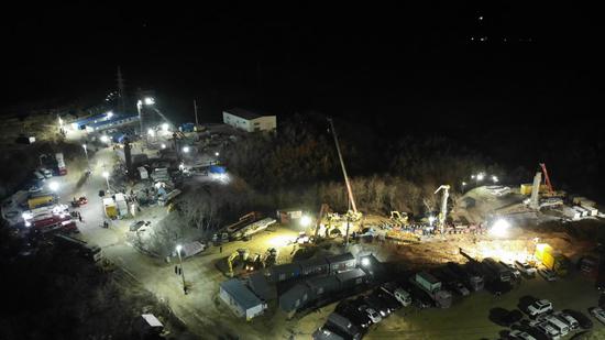 Aerial photo taken on Jan. 18, 2021 shows rescuers operating at the explosion site of a gold mine in Qixia City, east China's Shandong Province. (Xinhua/Wang Kai)