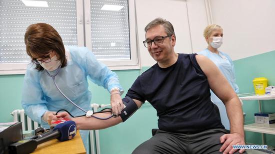 Serbian President Aleksandar Vucic checks blood pressure before receiving the second dose of the Chinese Sinopharm vaccine in Doljevac, Serbia, April 27, 2021. Serbian President Aleksandar Vucic on Tuesday received the second dose of the Chinese Sinopharm COVID-19 vaccine here in southeastern Serbia and expressed gratitude to China and the Chinese people for "enormous support and help." (Photo by Wang Wei/Xinhua)