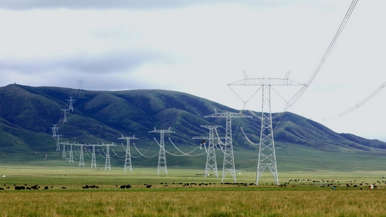 Photo taken on June 17, 2021 shows part of the Qinghai-Henan UHV DC power transmission line in Henan Mongolian Autonomous County of Huangnan Tibetan Autonomous Prefecture, northwest China's Qinghai Province. (Photo by Xie Lirong/Xinhua)