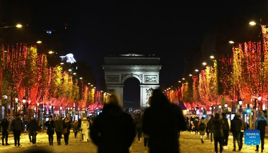 The Champs-Elysees Avenue and the Arc de Triomphe are seen amid Christmas illuminations in Paris, France, Nov. 21, 2021. The annual Christmas season lighting ceremony was held here on Sunday. (Xinhua/Gao Jing) 