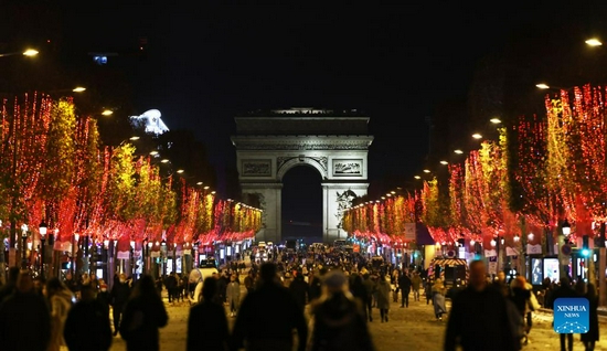 The Champs-Elysees Avenue and the Arc de Triomphe are seen amid Christmas illuminations in Paris, France, Nov. 21, 2021. The annual Christmas season lighting ceremony was held here on Sunday. (Xinhua/Gao Jing) 