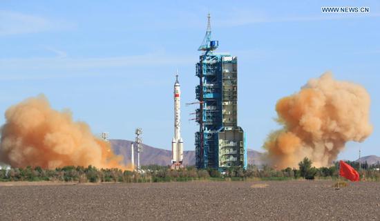 The crewed spacecraft Shenzhou-12, atop a Long March-2F carrier rocket, is launched from the Jiuquan Satellite Launch Center in northwest China's Gobi Desert, June 17, 2021. (Xinhua/Ju Zhenhua)