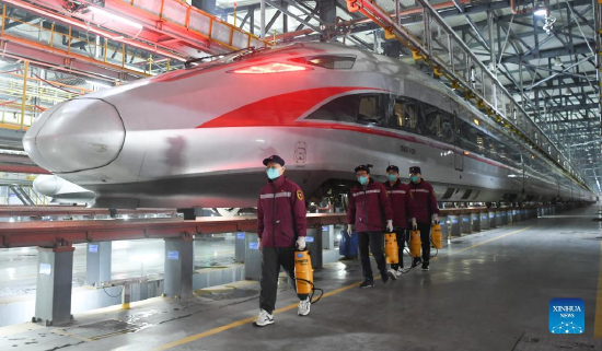 Epidemic prevention staff members prepare for disinfection at a railway station in Wuhan, central China's Hubei Province, Jan. 16, 2022. The number of railway passenger trips during China's upcoming Spring Festival travel rush is expected to jump 28.5 percent from the holiday season last year, industry data shows. During the 40-day travel season, also known as chunyun, many Chinese people will travel to meet their families for the Chinese Lunar New Year, or Spring Festival, which will fall on Feb. 1, 2022. (Xinhua/Cheng Min)