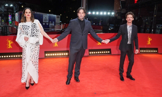 From left: French actress Noemie Merlant, Spanish director Isaki Lacuesta and Argentine actor Nahuel Perez Biscayart walk the red carpet for the screening of One Year, One Night presented in competition during the 72nd Berlinale Film Festival in Berlin on February 14, 2022. Photo: AFP