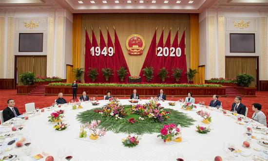 Wang Yang, a member of the Standing Committee of the Political Bureau of the Communist Party of China (CPC) Central Committee and chairman of the National Committee of the Chinese People's Political Consultative Conference (CPPCC), attends a reception to mark the National Day that falls on Oct. 1 in Beijing, capital of China, Sept. 27, 2020. The reception was organized by the General Office of the CPPCC National Committee, the United Front Work Department of the CPC Central Committee, the Overseas Chinese Affairs Office of the State Council, the Hong Kong and Macao Affairs Office of the State Council, the Taiwan Affairs Office of the State Council and the All-China Federation of Returned Overseas Chinese. (Xinhua/Gao Jie)