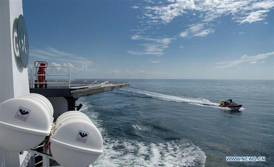  SpaceX support teams are deployed on a fast boat from the SpaceX recovery vessel GO Navigator ahead of a splashdown of the SpaceX Crew Dragon 