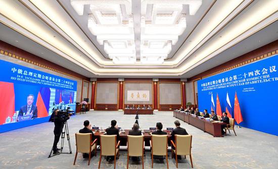 Chinese Vice Premier Hu Chunhua co-chairs the 24th session of the committee for regular meetings between Chinese and Russian heads of government via video link, together with Russian Deputy Prime Minister Dmitry Chernyshenko, on Nov. 24, 2020. (Xinhua/Yue Yuewei)